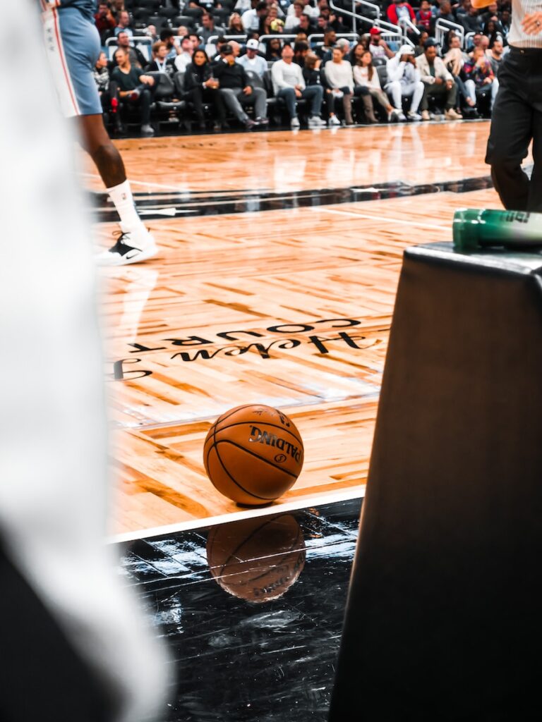 NBA 季中錦標賽 brown basketball on brown wooden floor